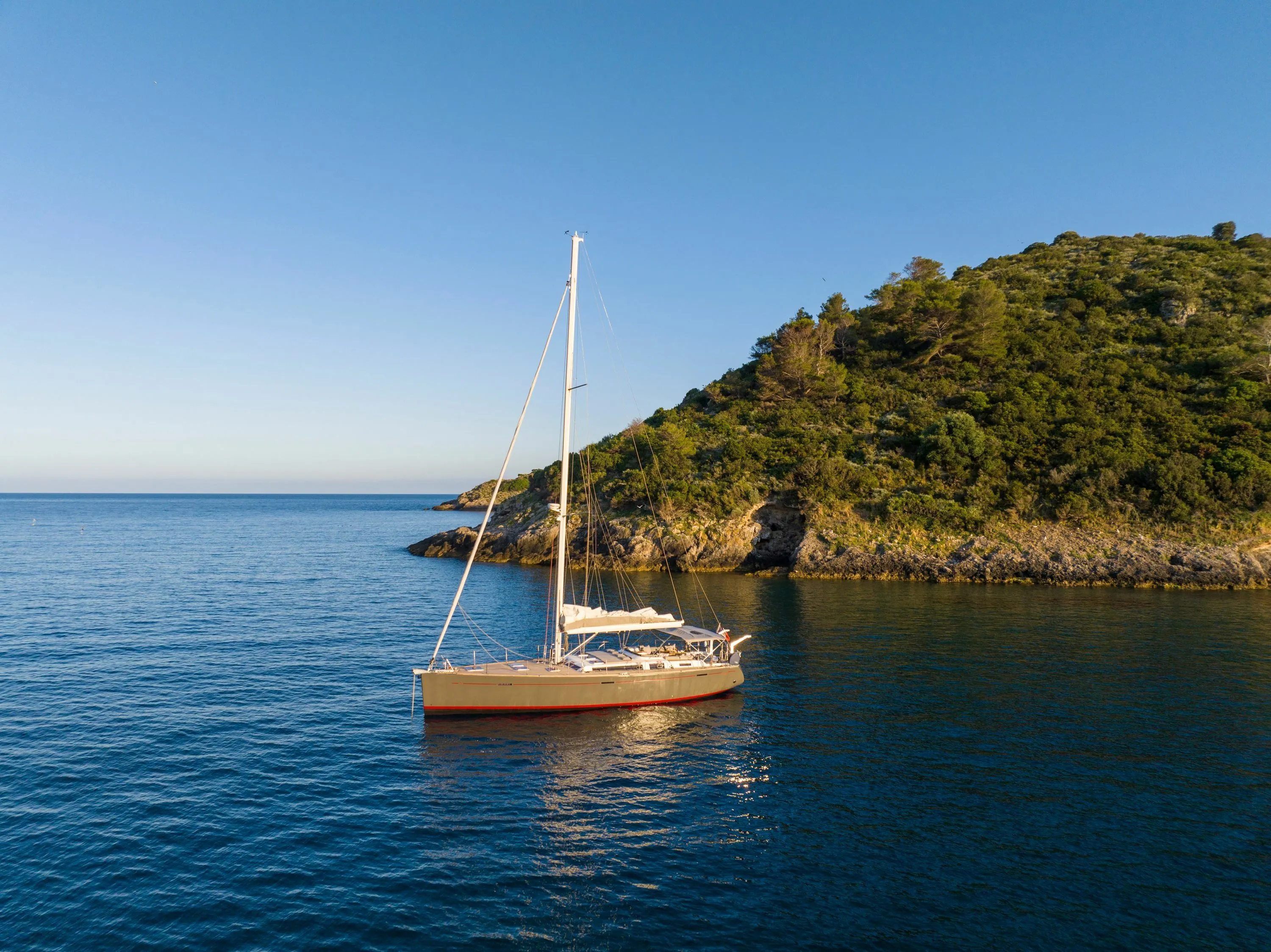 Explore Porto Pollo on a 16m 3 Cabin Sailing Yacht Rental