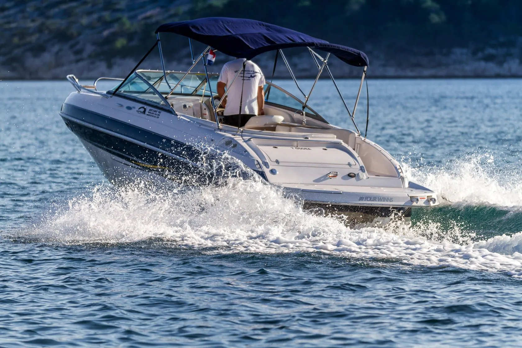 Rent a 7.5m Four Winns 230 Motor Boat in Rab
