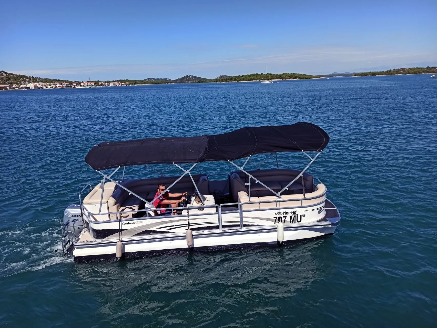 Explore Murter on a 6.7m Rental Power Catamaran Harris Sunliner 220