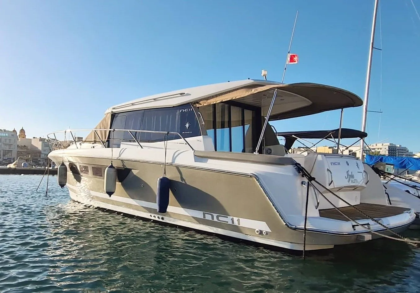 Explore Bugibba on a 11m 2 Cabin Motor Yacht Rental