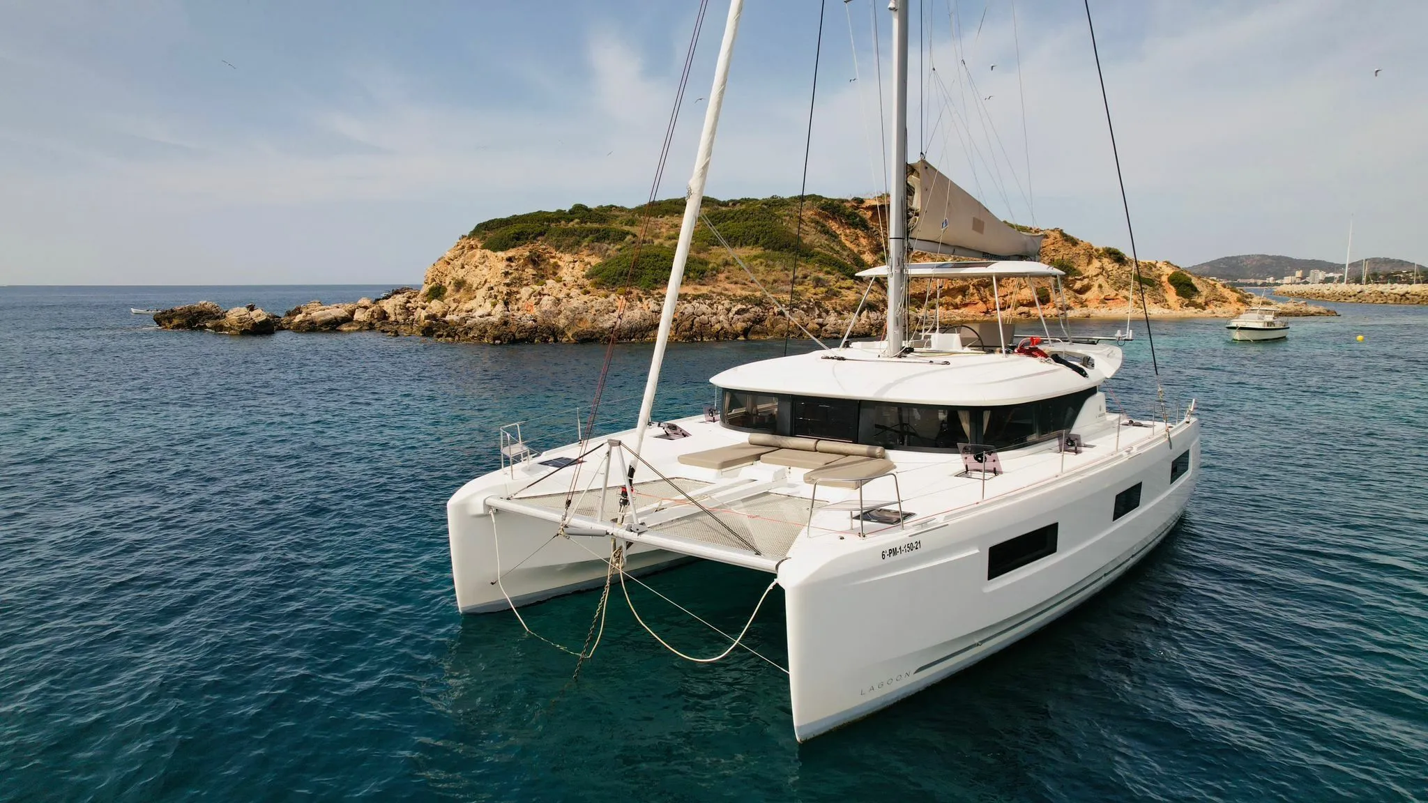 Explore Castillo del Aguila on a 14m Rental Catamaran Lagoon 46