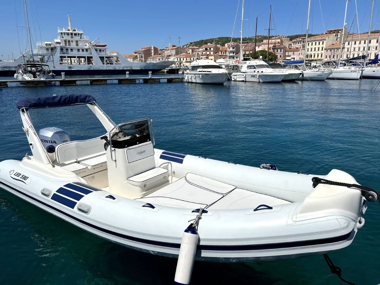 Explore Cannigione on a 6m Nautica LED 590 Motor Boat Rental
