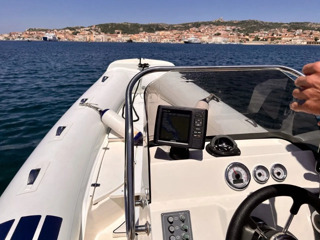 Explore Cannigione on a 6m Nautica LED 590 Motor Boat Rental