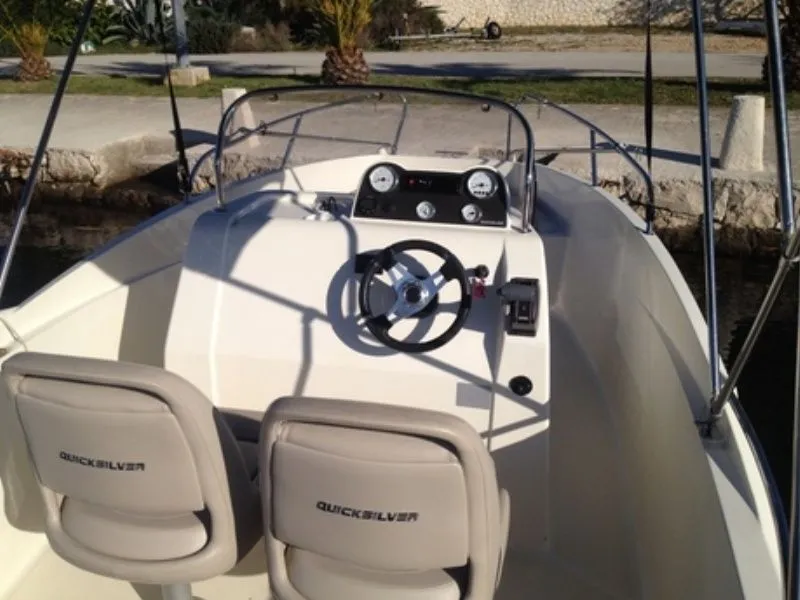 Explore Marina on a 5.55m Rental Motor Boat Quicksilver 555